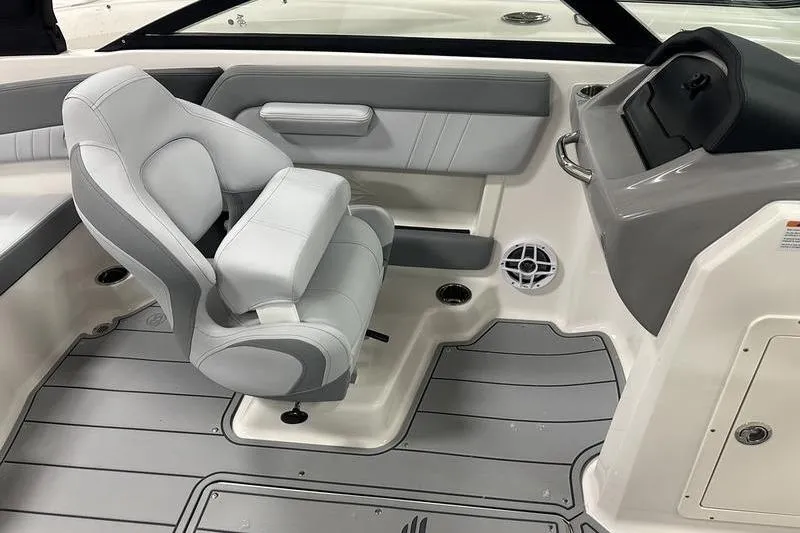 Slide: The Image of 2026 Chaparral 21 SSi boat interior with gray seating and modern dashboard. - 24