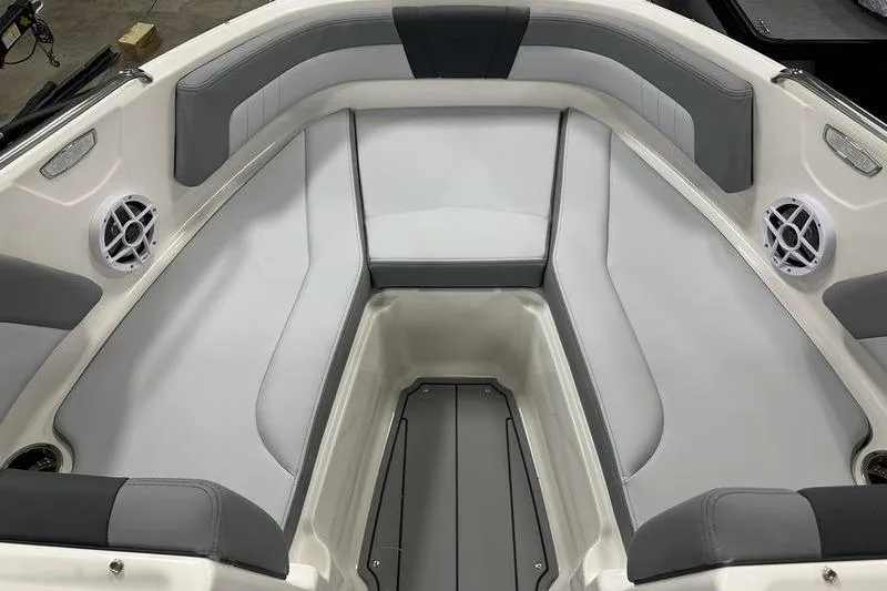 Slide: The Image of 2026 Chaparral 21 SSi boat interior with gray and white seating and speakers. - 30