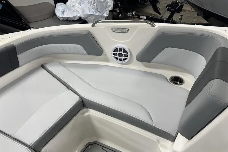 Slide: The Image of 2026 Chaparral 21 SSi boat interior with gray and white seating and speaker. - 33
