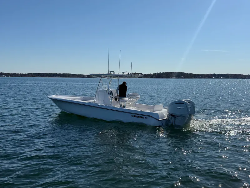 Slide: The Image of 2026 Contender 29 Bay boat cruising on a sunny day in open water. - 3