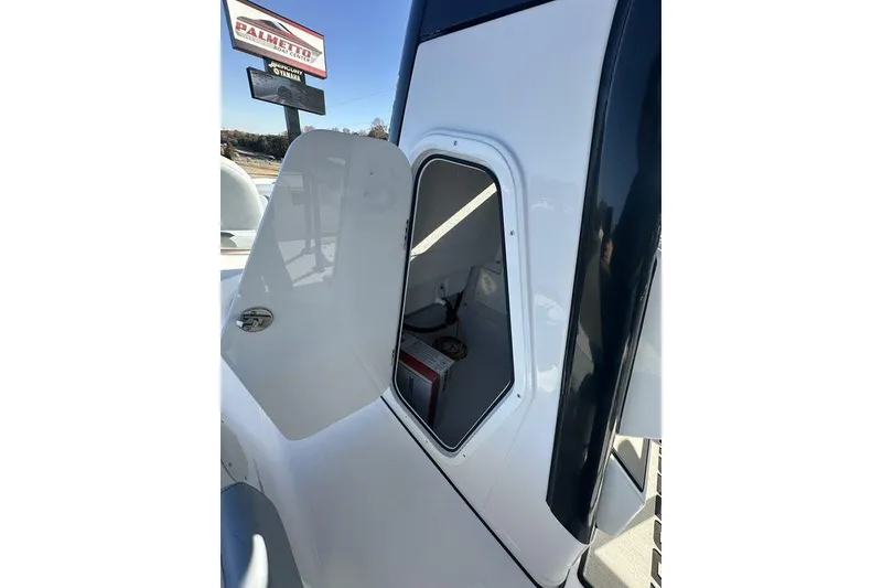 Slide: The Image of Open storage compartment on 2026 Sportsman Masters 227 Bay Boat, showcasing interior space. - 5