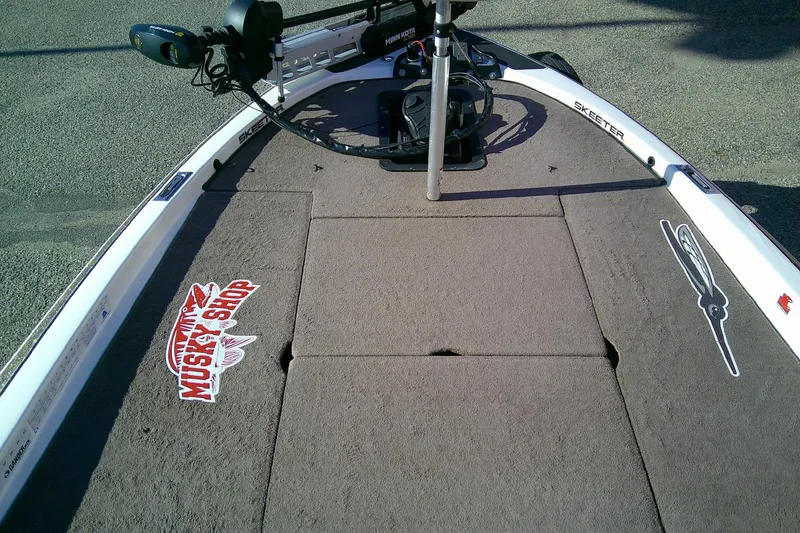 Slide: The Image of 2006 Skeeter ZX190 boat deck with fishing gear and Musky Shop logo. - 11