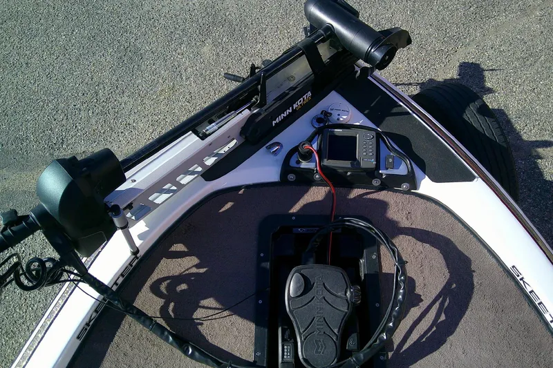 Slide: The Image of 2006 Skeeter ZX190 boat dashboard with Minn Kota trolling motor and fish finder. - 12