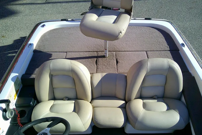 Slide: The Image of 2006 Skeeter ZX190 boat interior with beige leather seats and steering wheel. - 15