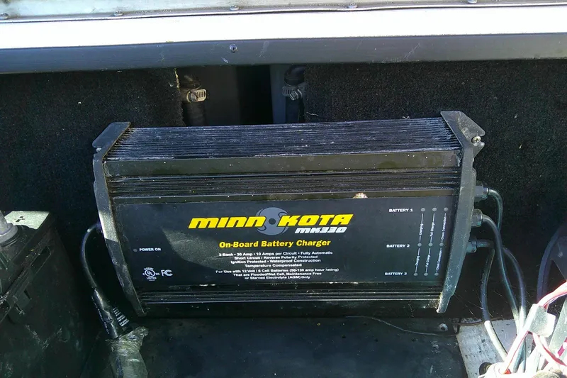 Slide: The Image of Minn Kota MK330 on-board battery charger in 2006 Skeeter ZX190 boat compartment. - 17