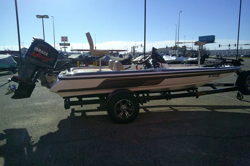 Slide: The Image of 2006 Skeeter ZX190 boat with Yamaha engine on trailer in parking lot. - 7