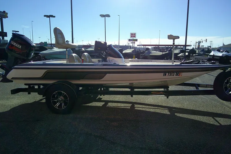 Slide: The Image of 2006 Skeeter ZX190 boat with Yamaha engine on trailer in parking lot. - 8