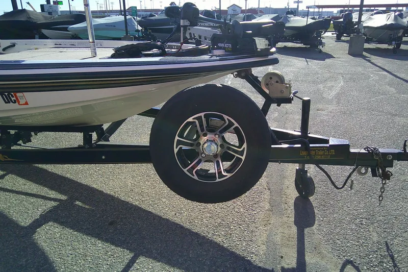 Slide: The Image of 2006 Skeeter ZX190 boat on trailer, featuring a spare tire and winch system. - 9
