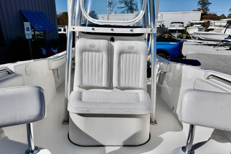 Slide: The Image of 2015 Sea Fox 246 Commander boat interior with white seating and console. - 11