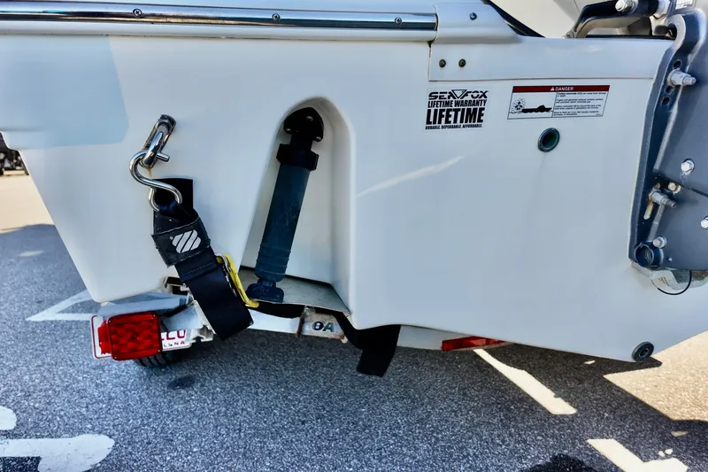 Slide: The Image of Rear view of a 2015 Sea Fox 246 Commander boat with trailer attachment. - 16