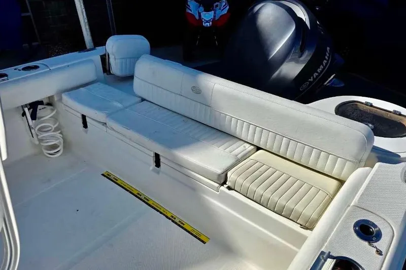 Slide: The Image of 2015 Sea Fox 246 Commander boat interior with white seating and Yamaha engine. - 18