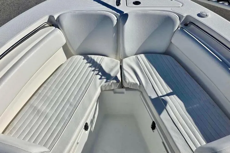 Slide: The Image of 2015 Sea Fox 246 Commander boat interior with white cushioned seating. - 20