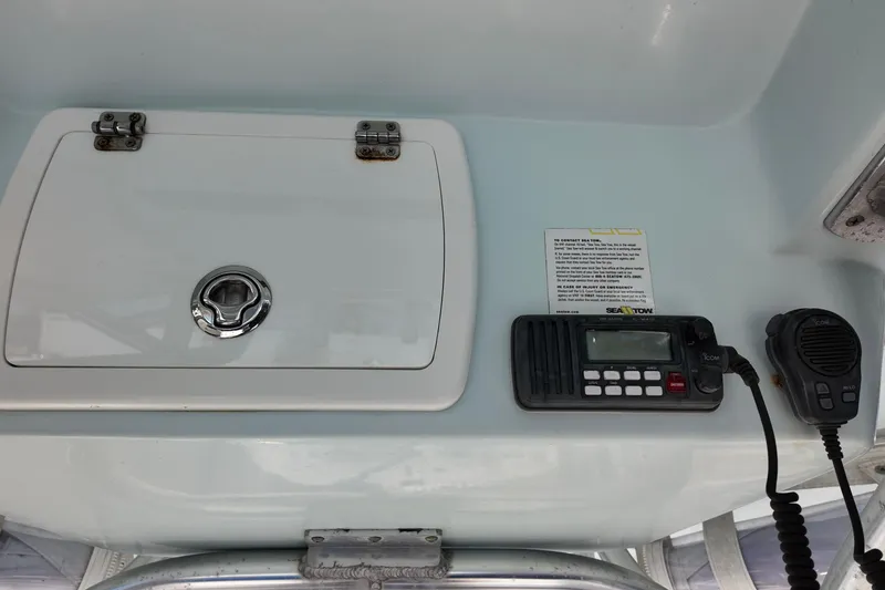 Slide: The Image of 2015 Sea Fox 246 Commander boat console with radio and storage compartment. - 4