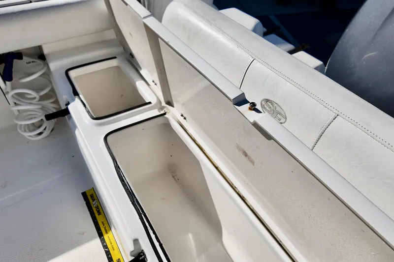 Slide: The Image of 2015 Sea Fox 246 Commander boat storage compartments and seating detail. - 6