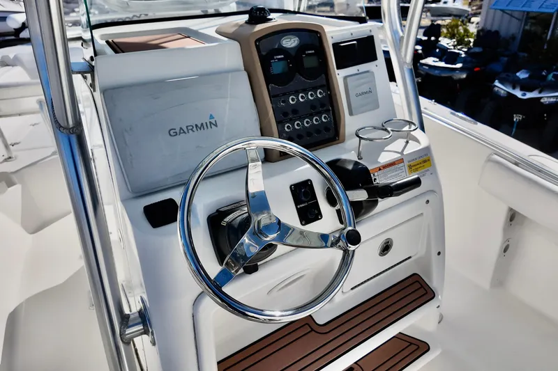 Slide: The Image of 2015 Sea Fox 246 Commander boat dashboard with Garmin navigation system and steering wheel. - 9