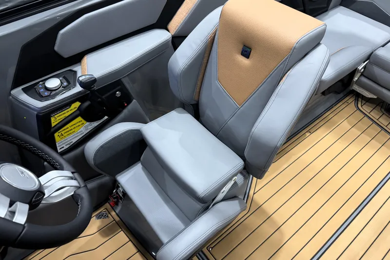 Slide: The Image of 2026 Nautique Super Air Nautique S21 interior with luxurious seating and modern controls. - 17