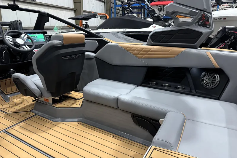 Slide: The Image of 2026 Nautique Super Air Nautique S21 interior with modern seating and advanced dashboard. - 18