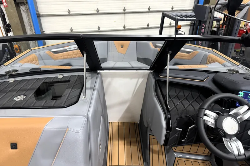 Slide: The Image of 2026 Nautique Super Air Nautique S21 interior with luxury seating and modern dashboard design. - 23