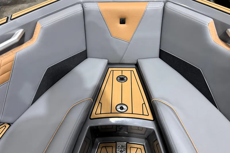Slide: The Image of 2026 Nautique Super Air Nautique S21 interior with sleek gray and tan seating. - 31