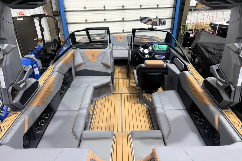 Slide: The Image of Interior of 2026 Nautique Super Air Nautique S21, featuring luxurious seating and modern dashboard. - 35