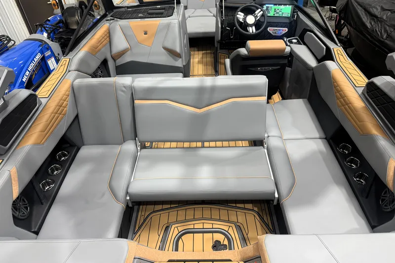 Slide: The Image of 2026 Nautique Super Air Nautique S21 interior with luxurious seating and modern dashboard. - 36
