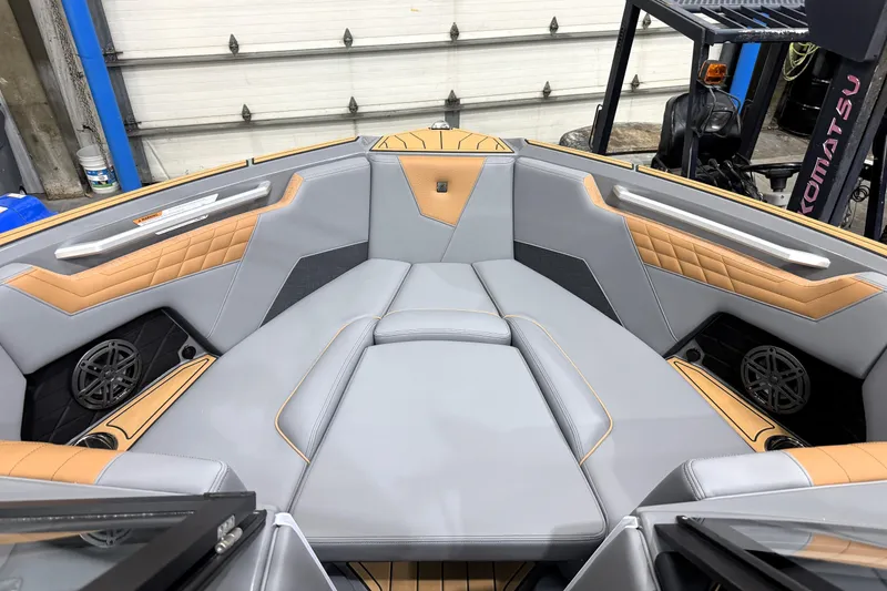 Slide: The Image of 2026 Nautique Super Air Nautique S21 interior with gray and tan upholstery. - 38