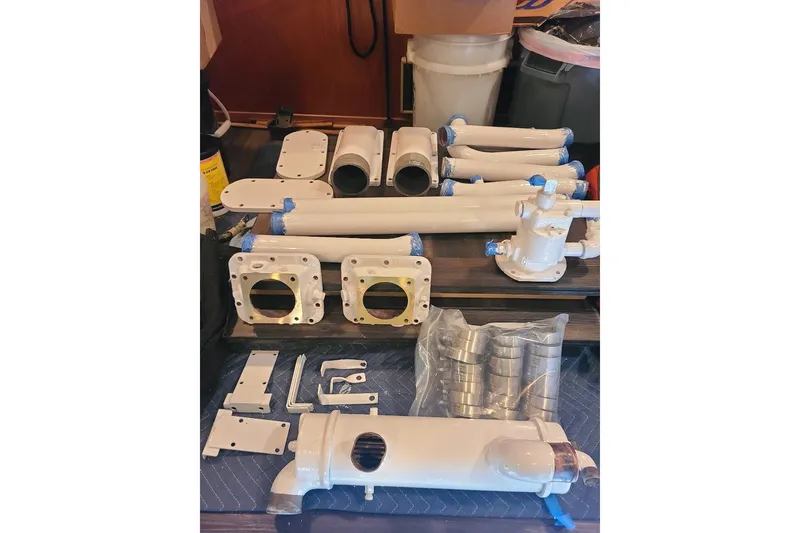 Slide: The Image of Assorted white engine parts for 1985 Post 43 Convertible boat. - 19