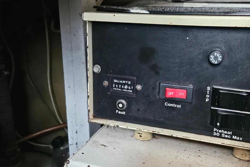 Slide: The Image of 1985 Post 43 Convertible boat with Simrad equipment at a marina dock. - 2