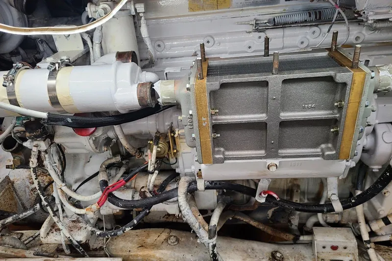 Slide: The Image of Engine components of a 1985 Post 43 Convertible boat, featuring detailed mechanical parts. - 21