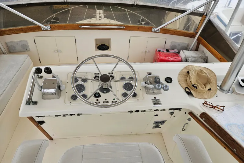 Slide: The Image of 1985 Post 43 Convertible yacht cruising on calm blue waters under clear sky. - 3