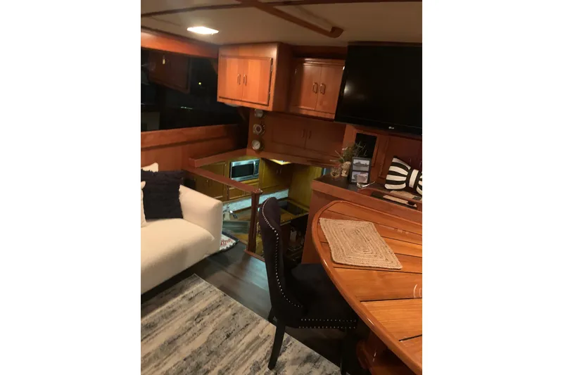 Slide: The Image of 1985 Post 43 Convertible boat helm with steering wheel and control panel. - 6