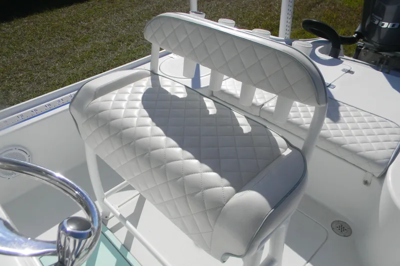 Slide: The Image of 2015 Yellowfin 24 Bay boat console with Garmin navigation and steering wheel. - 11