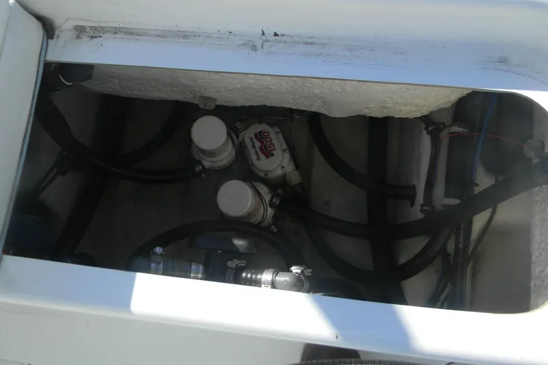 Slide: The Image of 2015 Yellowfin 24 Bay boat interior showing mechanical components and wiring. - 3