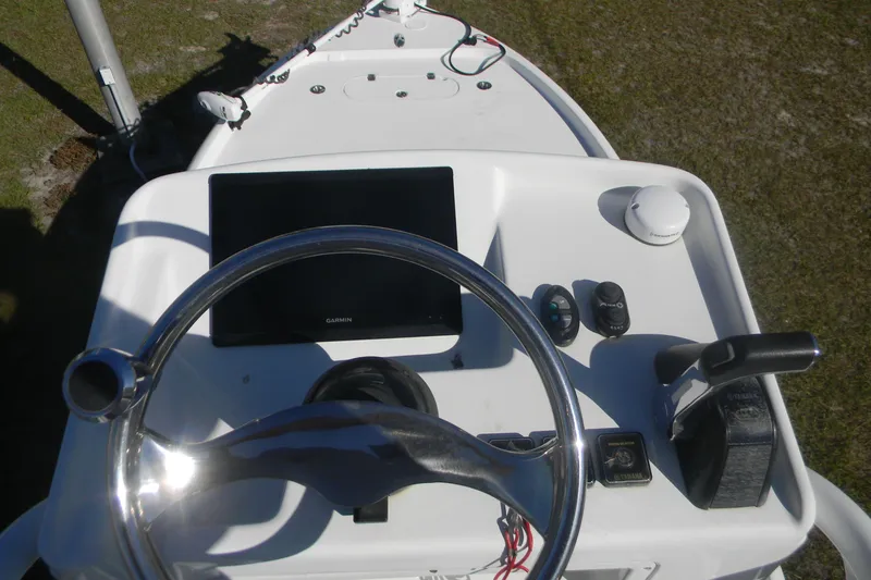 Slide: The Image of 2015 Yellowfin 24 Bay boat interior compartment with hoses and fittings. - 4