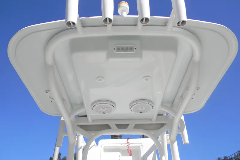 Slide: The Image of 2015 Yellowfin 24 Bay boat deck with storage compartments and trolling motor. - 8