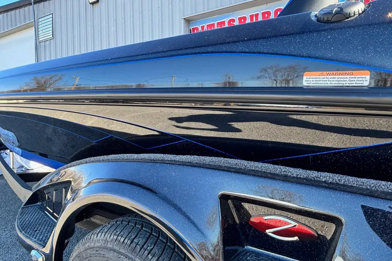 Slide: The Image of 2026 Ranger Z521 boat with sleek black exterior and detailed design elements. - 10
