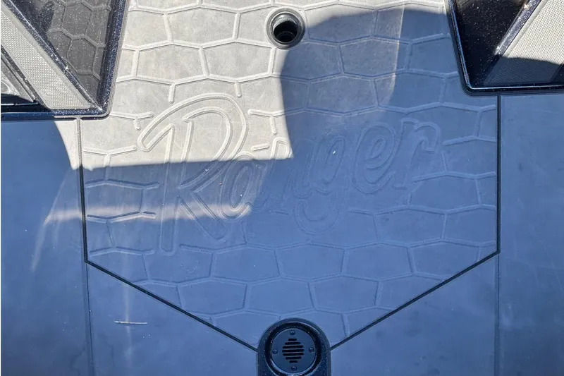 Slide: The Image of 2026 Ranger Z521 boat deck with embossed logo and hexagonal pattern. - 12