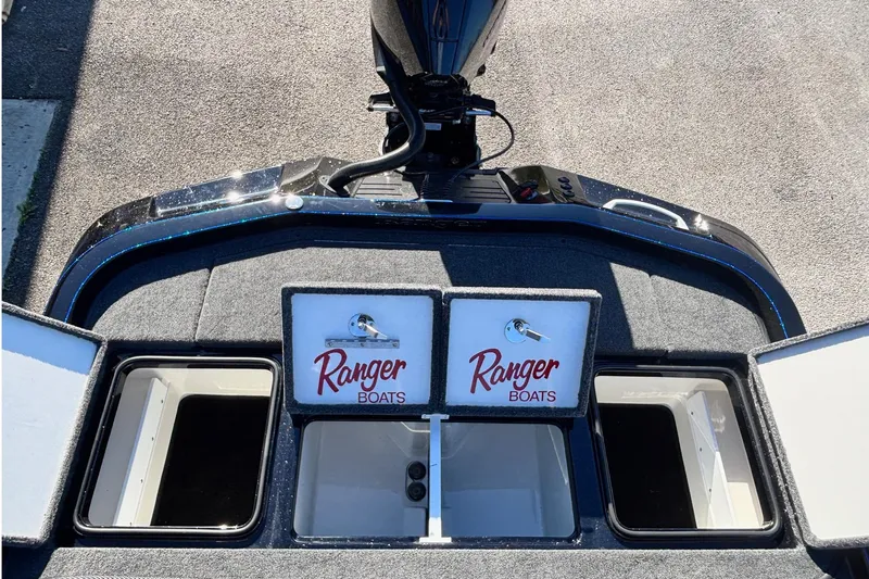 Slide: The Image of 2026 Ranger Z521 boat storage compartments with logo, viewed from above. - 14