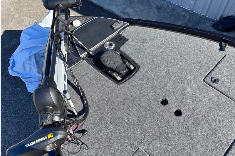 Slide: The Image of 2026 Ranger Z521 boat deck with Minn Kota trolling motor and control panel. - 3