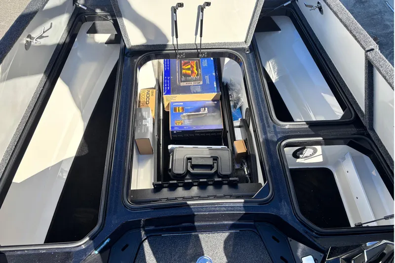 Slide: The Image of 2026 Ranger Z521 boat storage compartments with various equipment and accessories. - 5