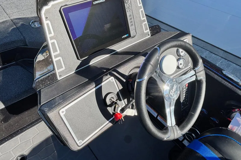 Slide: The Image of 2026 Ranger Z521 boat dashboard with steering wheel and electronic display. - 8