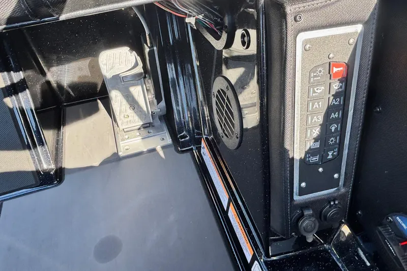 Slide: The Image of 2026 Ranger Z521 boat dashboard with control panel and foot pedal. - 9