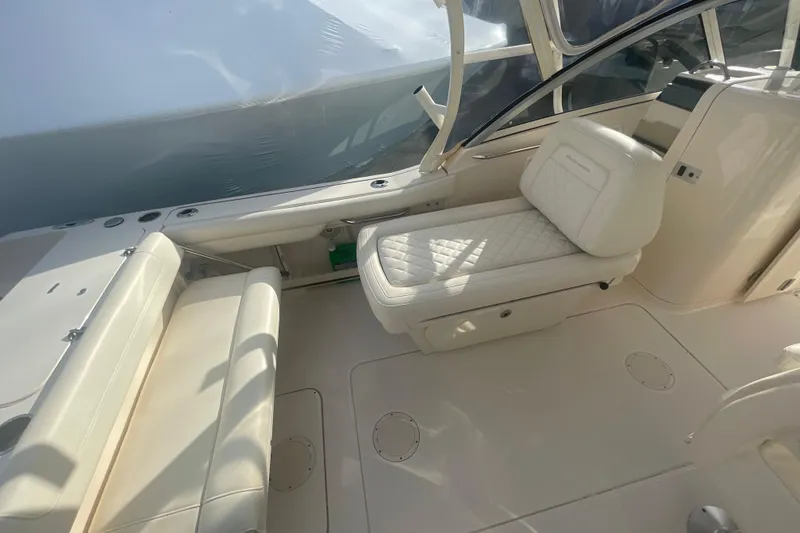 Slide: The Image of 2018 Grady-White Freedom 235 boat interior with white seating and sleek design. - 37
