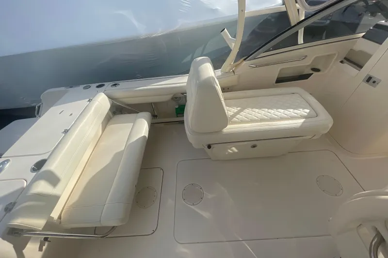 Slide: The Image of 2018 Grady-White Freedom 235 boat interior with white seating and sleek design. - 38