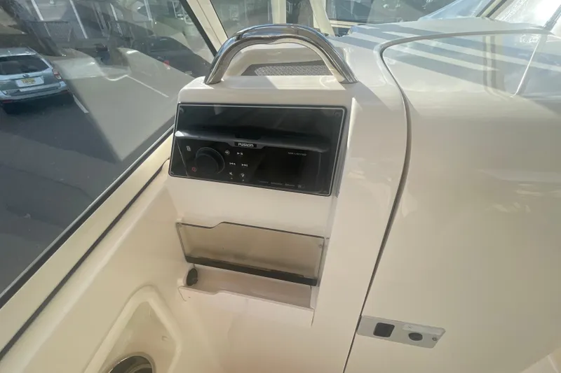 Slide: The Image of 2018 Grady-White Freedom 235 boat interior with Fusion stereo system. - 46