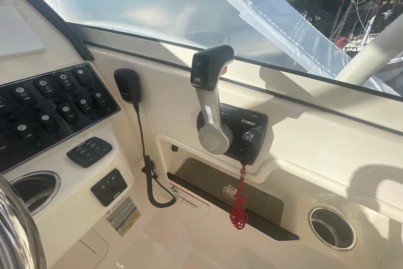 Slide: The Image of Control panel of 2018 Grady-White Freedom 235 boat with Yamaha throttle and switches. - 51