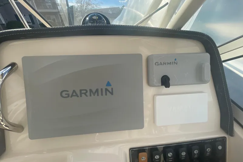 Slide: The Image of Dashboard of 2018 Grady-White Freedom 235 with Garmin navigation equipment. - 53