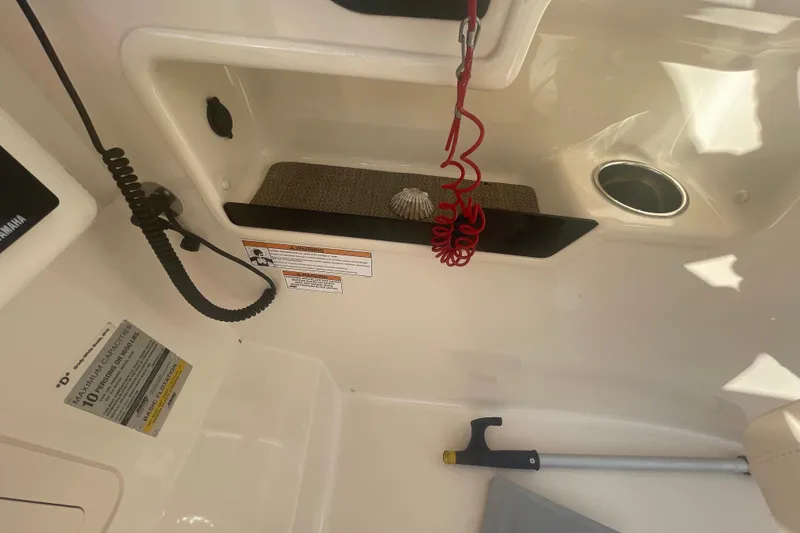 Slide: The Image of Interior of 2018 Grady-White Freedom 235 boat with safety features and storage. - 57