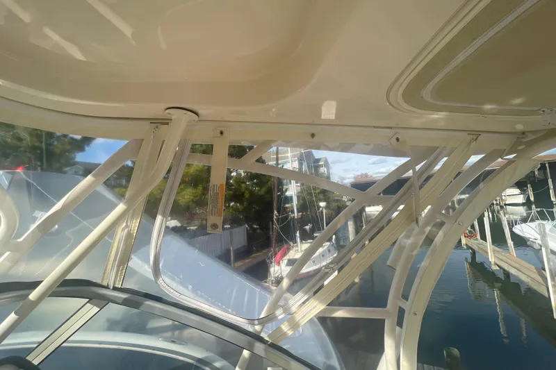 Slide: The Image of 2018 Grady-White Freedom 235 boat interior with marina view through windows. - 64