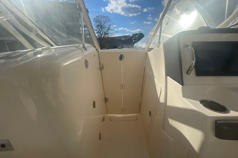 Slide: The Image of 2018 Grady-White Freedom 235 boat interior with sunlight and clear skies. - 65